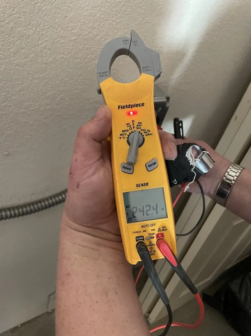 Voltage testing with clamp meter during Generator Installation in Wahoo